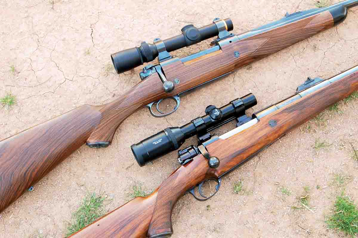 A pair of rifles with custom bottom metal. Note the rifle on the bottom has a deeper magazine than the rifle on top.